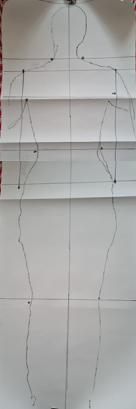 Body outline drawn on whit paper